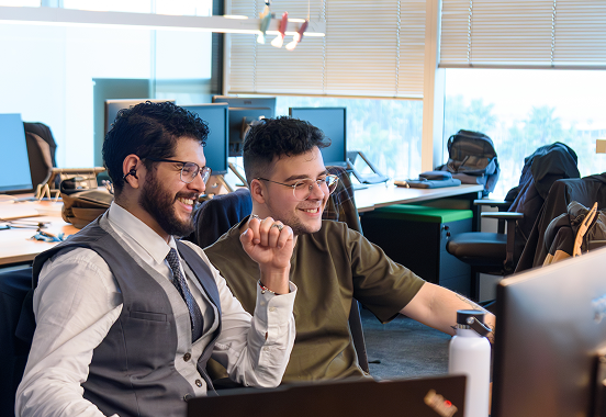 Leadtech team members collaborating at their desks